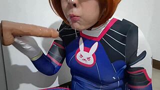 trans girl with dva cosplay and bdsm nosehook giving a blowjob eating cum and deepthroat to big dildo