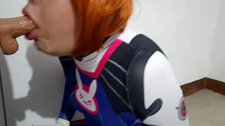 trans girl with dva cosplay and bdsm nosehook giving a blowjob eating cum and deepthroat to big dildo