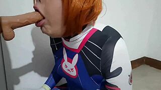 trans girl with dva cosplay and bdsm nosehook giving a blowjob eating cum and deepthroat to big dildo