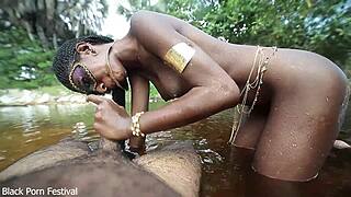 dark skin african beauty with goddess body riding in river