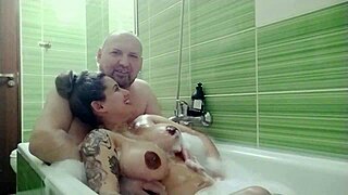 Couple relaxes together in the bath