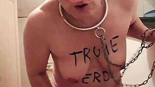 Female slave performs self-submission session in sow mode, embracing whore bdsm slut role